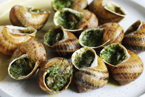 Escargots met knoflook-kruidenboter en pastis